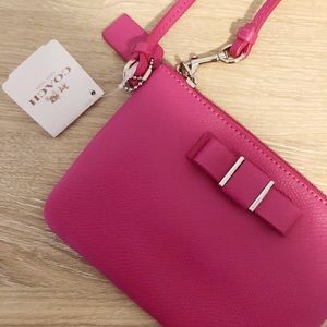 Coach Pink wristlet with bow